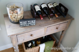 creating a farmhouse inspired wine nook, creating a wine nook, farmhouse inspired, farmhouse decor, wine nook, wine, wine corner, wine bottles, wine glasses, quote decor, sayings decor, DIY art, wine crafts, cork crafts